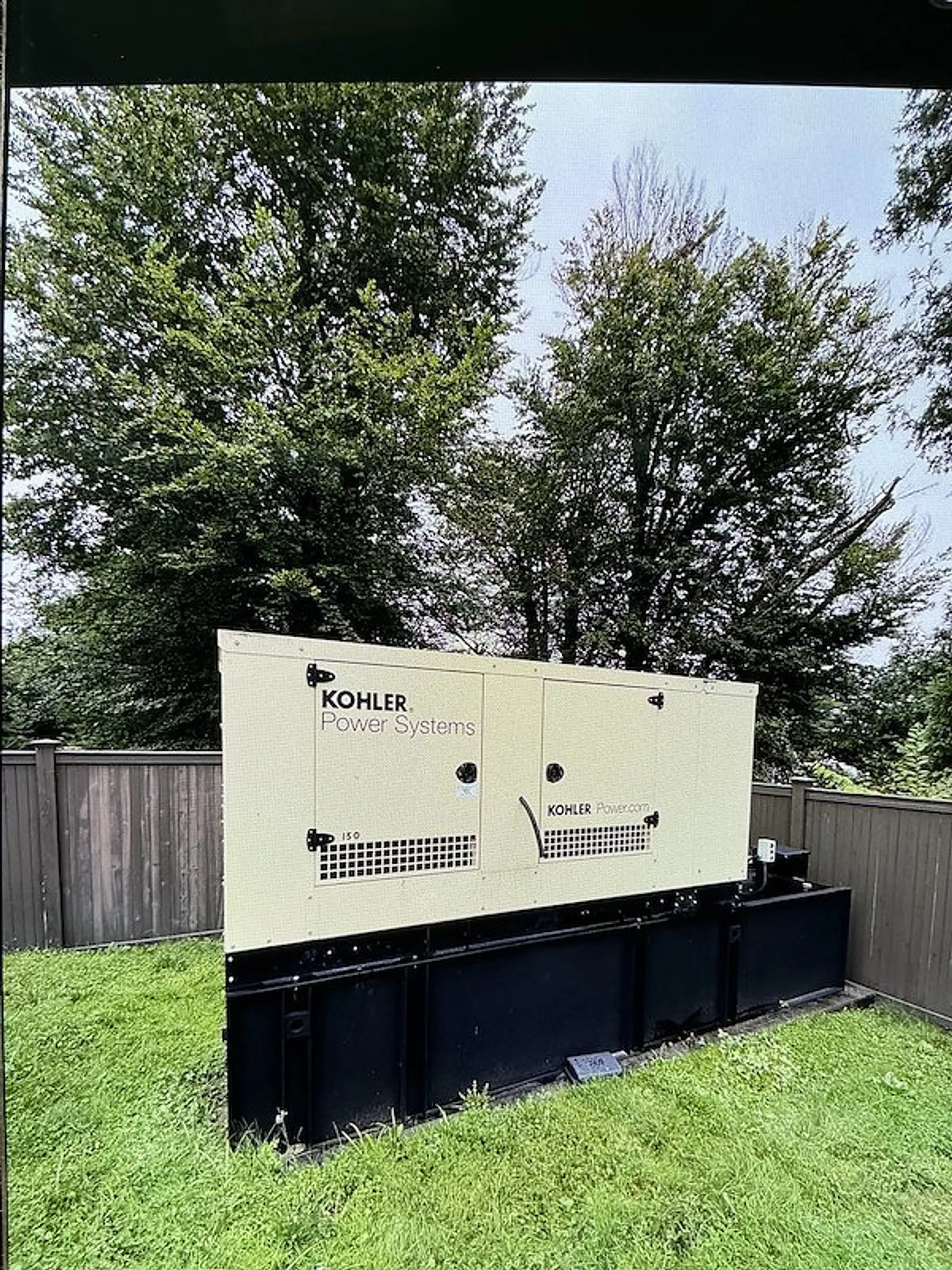 Commercial standby generator outside an office building