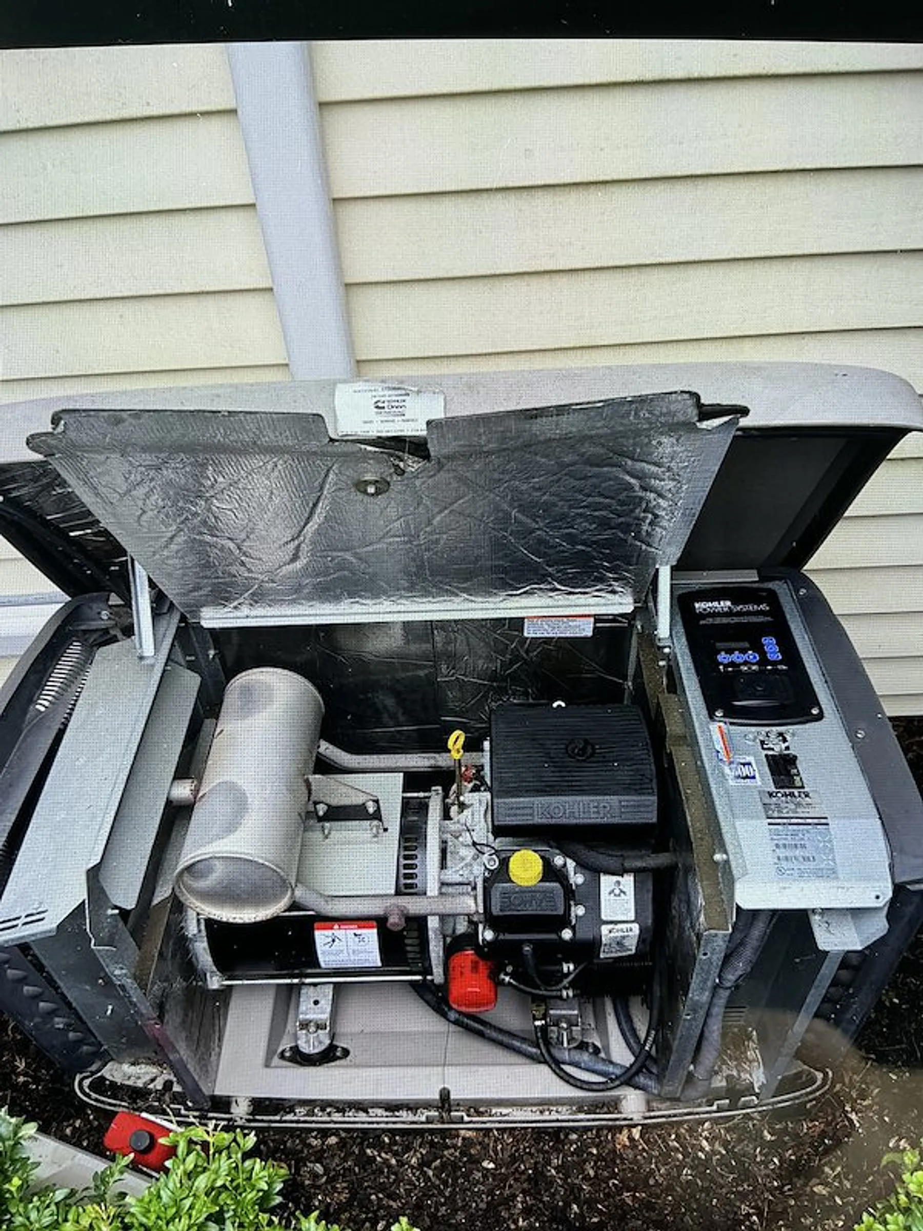 Home standby generator opened for service