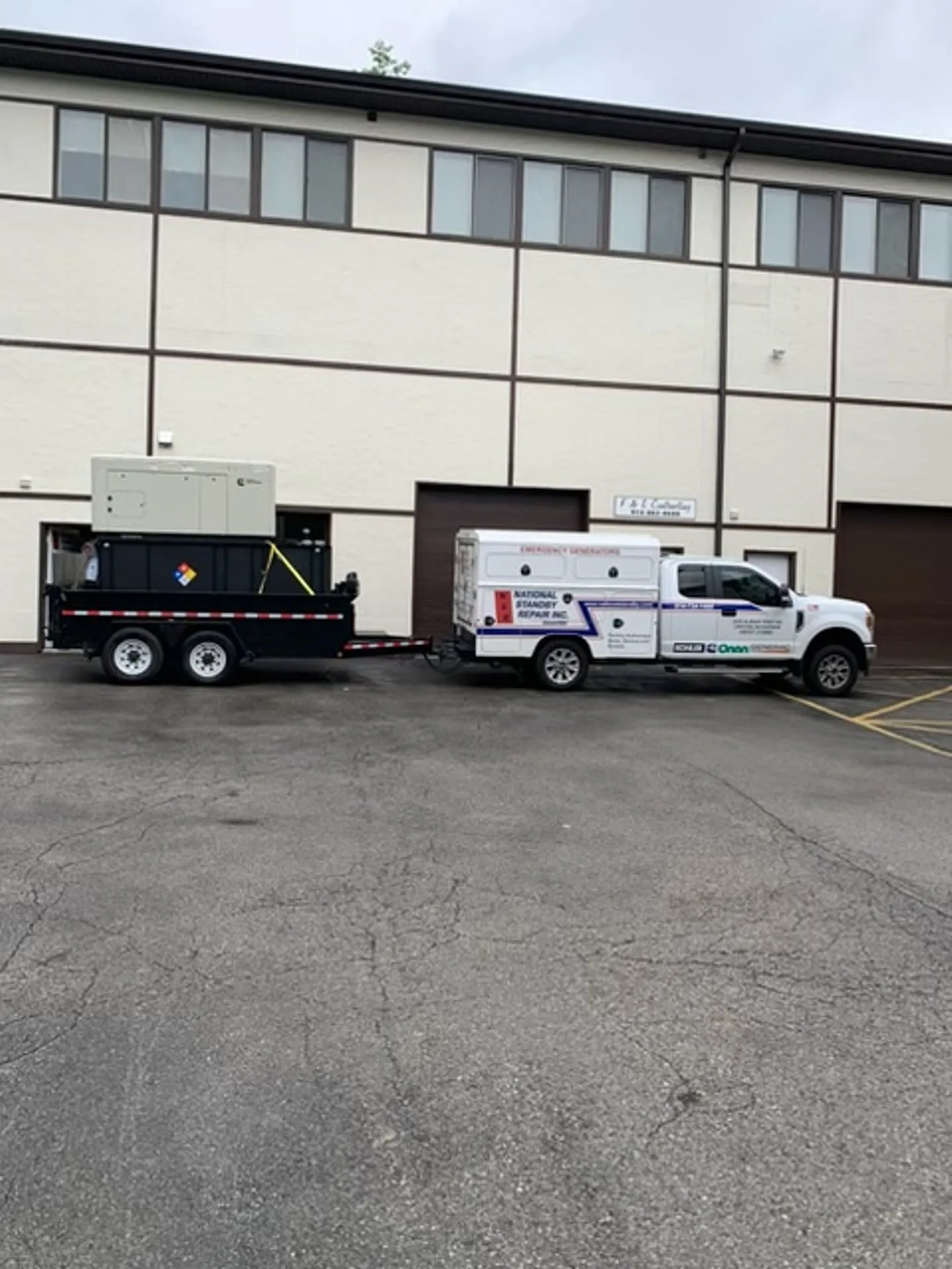 National Standby truck delivering a trailer-mounted rental generator